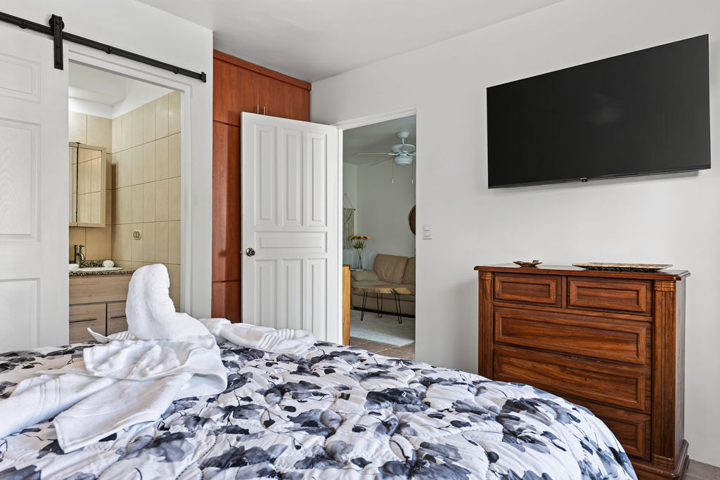 Bedroom one with smart TV